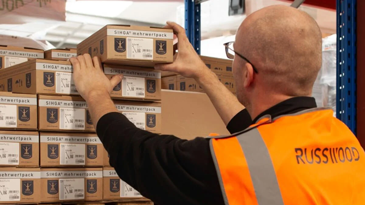 Russwood Team Member Raf putting away a box of SIHGA fixings