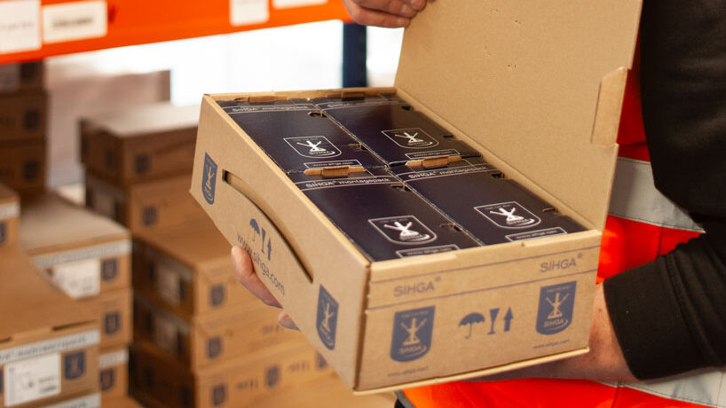 Russwood Team Member Raf putting away a box of SIHGA fixings